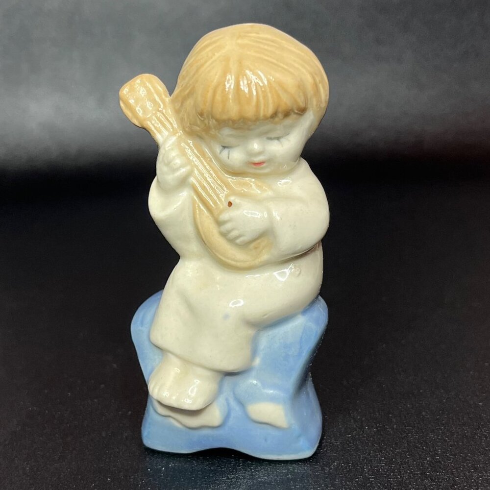 Porcelain Figurine Child Sitting on Star Playing Guitar Vintage